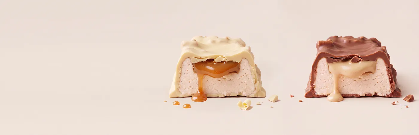 A white-chocolate bar and a milk-chocolate bar, cut open