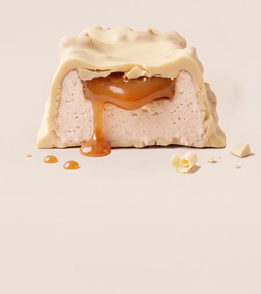 A white-chocolate crispy bar broken open with caramel