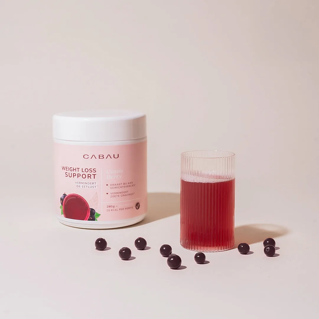 A tub of powder with a glass of red drink and dark berries