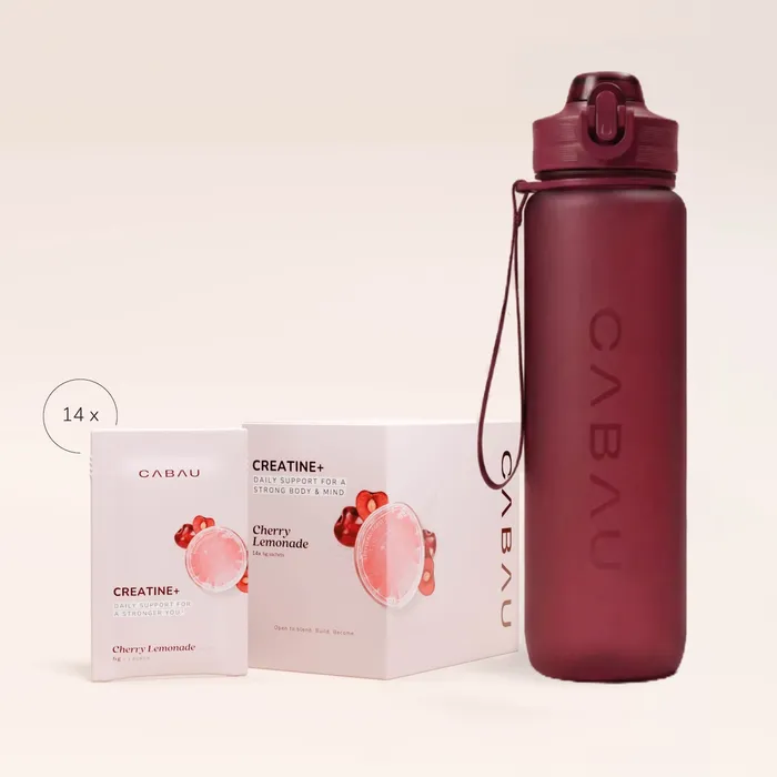 Cabau sips box beside a cherry-red bottle