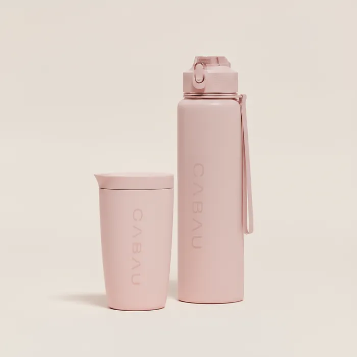 Soft pink Bloom Cup next to a pink bottle
